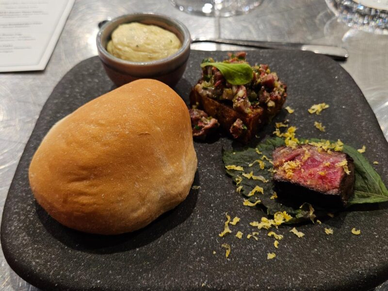 Coonawarra Experiences – Bread, butter, tartare cube, and rare beef with lemon zest.