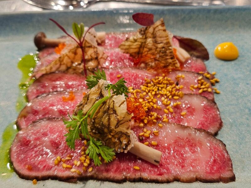 Coonawarra Experiences – Wagyu carpaccio with sesame, roe, herbs, and mushrooms.