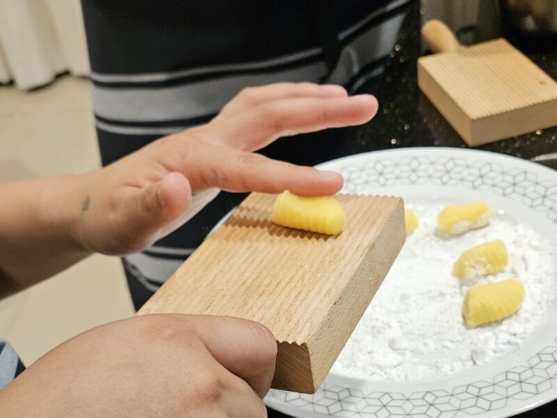 Person making gnocchi in a kitchen