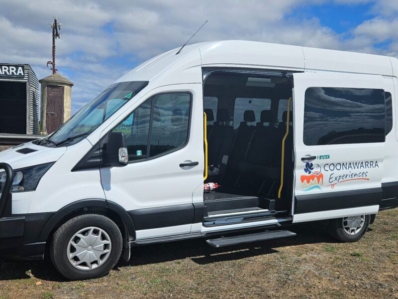 Wide sliding door and easy step entry on Ford Transit tour vehicle