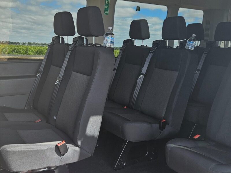 Full standing height interior of Ford Transit tour vehicle