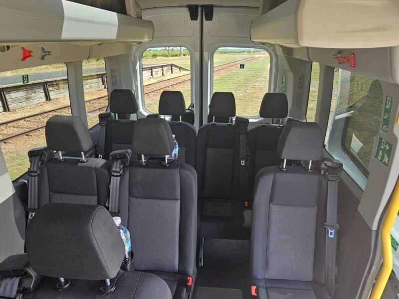 Comfortable passenger seating inside Ford Transit tour vehicle in Coonawarra