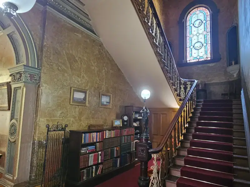 Grand staircase at Yallum Park with the original stained glass window