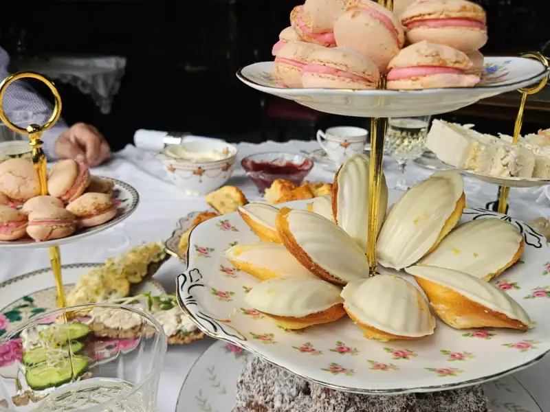 High tea tiered stand of macarons, madeleines and finger sandwiches at Yallum Park